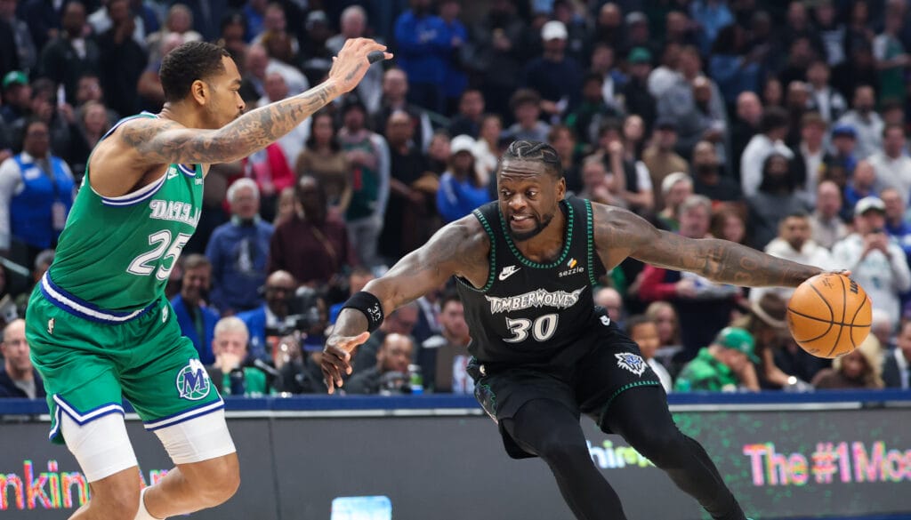 Mavericks forward P.J. Washington guarding Wolves' Julius Randle