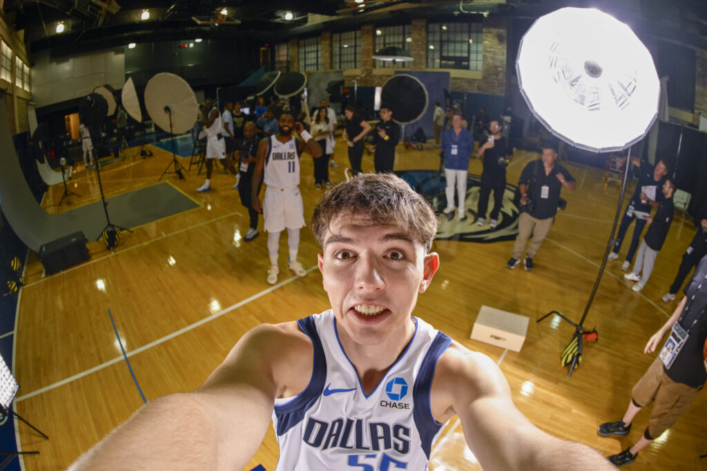 Mavericks guard Sergio de Larrea (55) and guard Kyrie Irving (11) take a selfie photo during the Mavericks media day at American Airlines Center.