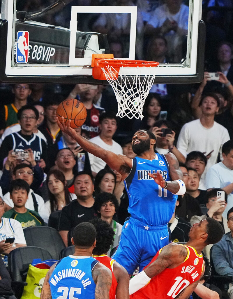 Basketball - NBA - Preseason - China Games 2026 - Houston Rockets v Dallas Mavericks - The Venetian Arena, Macao, China - October 11, 2026 Houston Rockets' Jabari Smith Jr. in action with Dallas Mavericks' Kyrie Irving REUTERS/Lam Yik