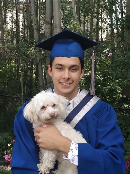 Coyotes forward Dylan Guenther celebrates graduation with Zooey.