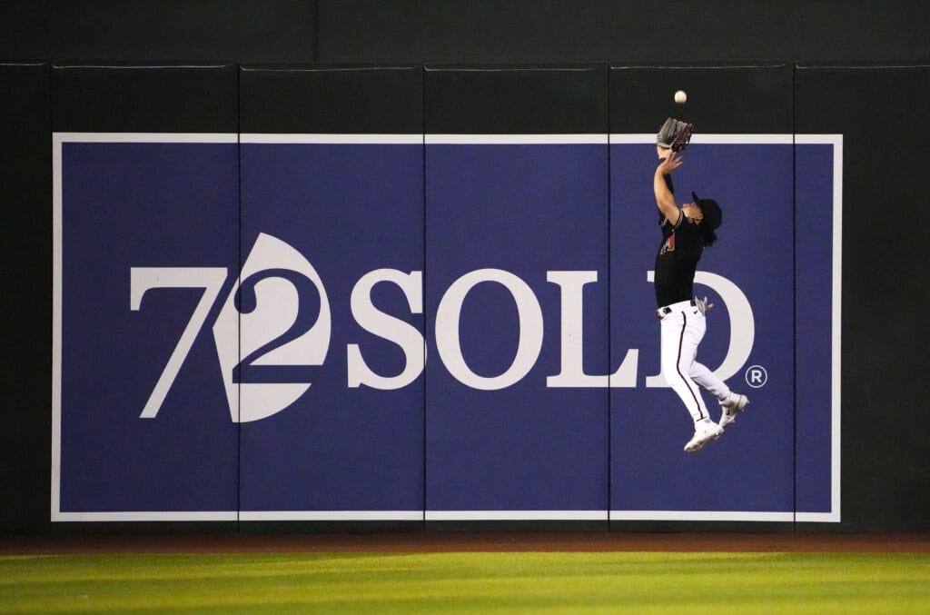 Diamondbacks outfielder Alek Thomas makes a nice catch at the wall at Chase Field.