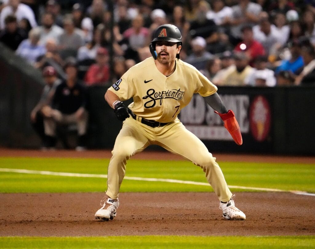 Diamondbacks outfielder Corbin Carroll takes an aggressive lead off first base.