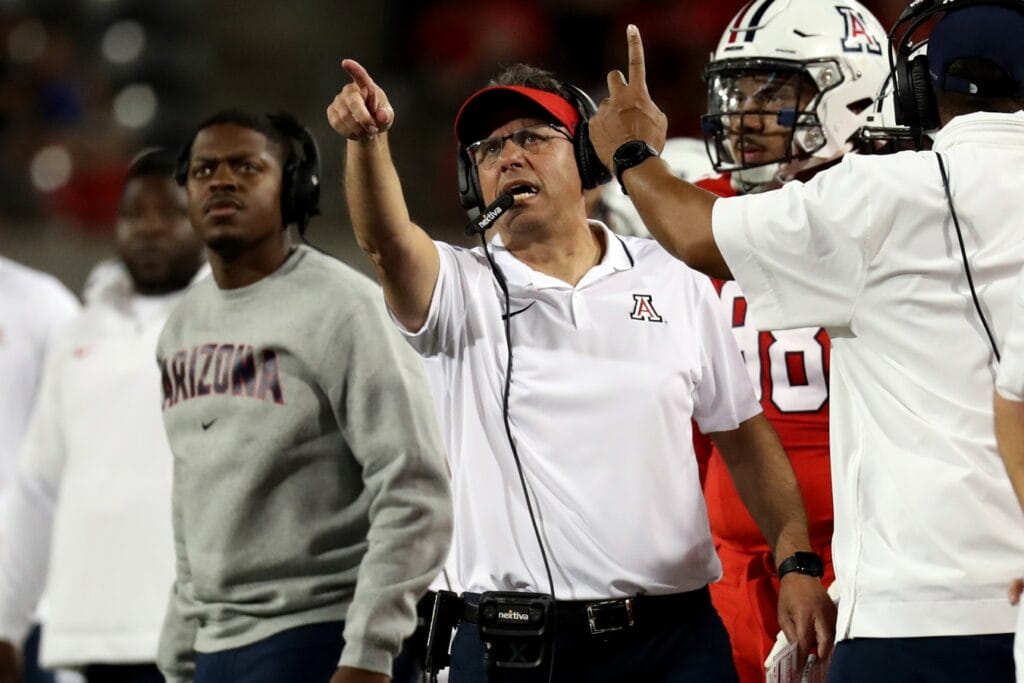 Arizona head coach Jedd Fisch points at the scoreboard after a fumble call in the game against Washington. (Zachary BonDurant-USA TODAY Sports)