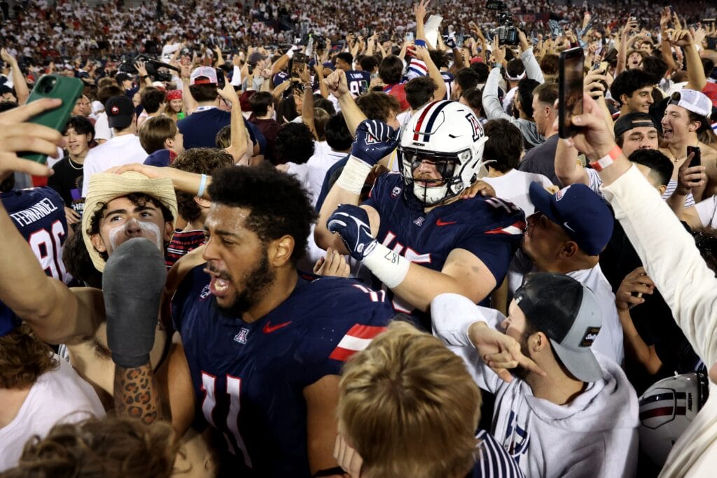 The Wildcats celebrate with the students after a 27 - 10 victory over UCLA (Zachary BonDurant-USA TODAY Sports)