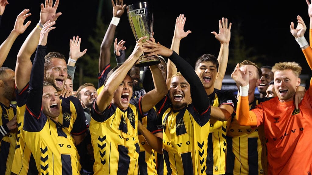 Charleston Battery lift the Eastern Conference trophy after defeating Louisville City.
