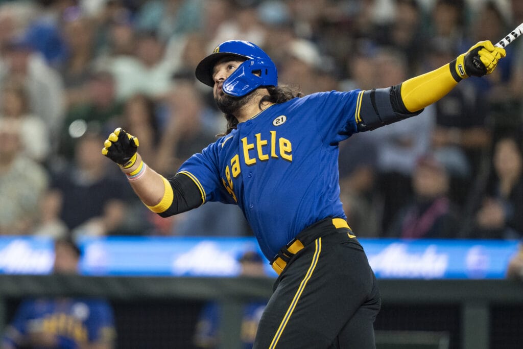 Seattle Mariners third baseman Eugenio Suarez (28) hits a solo home run off Los Angeles Dodgers starting pitcher Bobby Miller (70) during the fourth inning at T-Mobile Park.