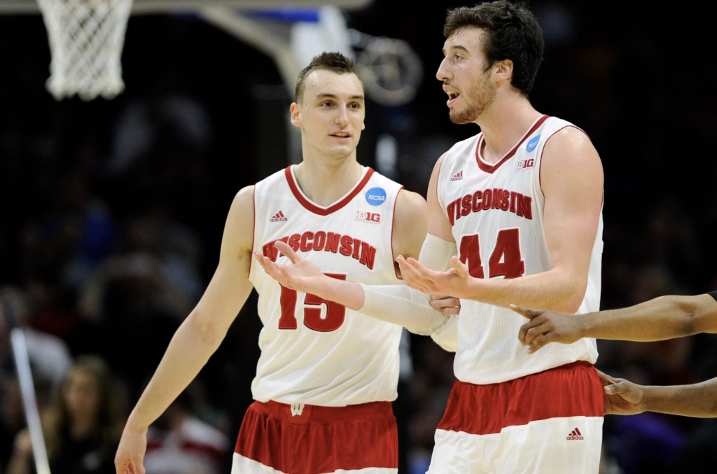 Wisconsin Badgers forward Sam Dekker (15) speaks with forward Frank Kaminsky (44) against Arizona during the second half in the West Regional final of the 2015 NCAA Tournament at Staples Center in Los Angeles. (Mandatory Credit: Robert Hanashiro-USA TODAY Sports)