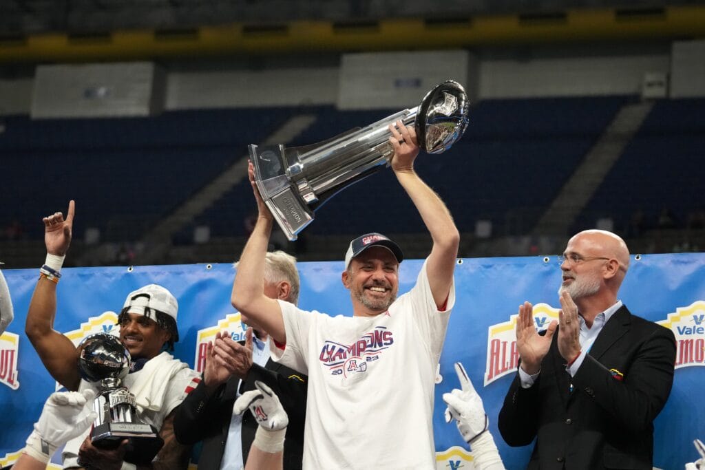 Arizona Wildcats head coach Jedd Fisch holds the Alamo Bowl trophy after the victory over the Oklahoma Sooners (Kirby Lee-USA TODAY Sports)