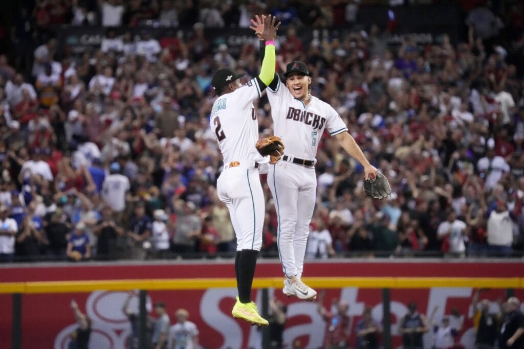 The Diamondbacks’ Alek Thomas and Geraldo Perdomo celebrate their 4-2 series-clinching win against the Los Angeles Dodgers during their National League Division Series game at Chase Field.