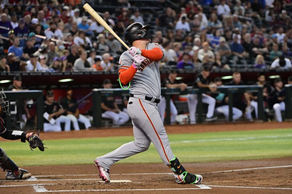 Giants designated hitter Joc Pederson (23) hits a solo home run in the first inning against the Arizona Diamondbacks at Chase Field.