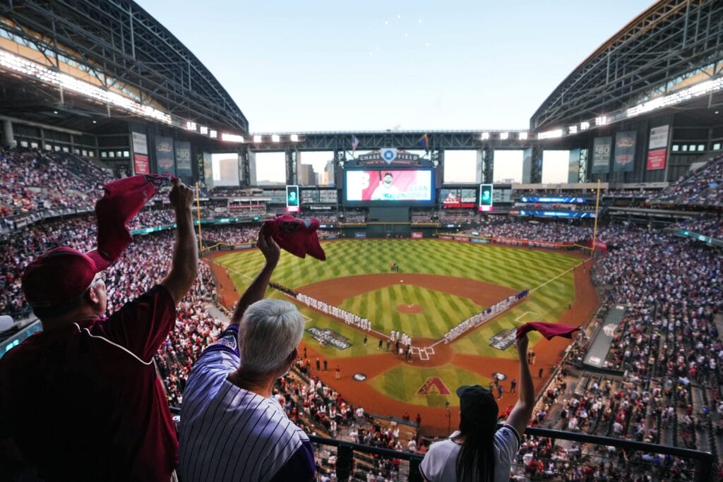 Fans at Chase Field cheer from the stands before the Arizona Diamondbacks play the Los Angeles Dodgers during their National League Division Series game.