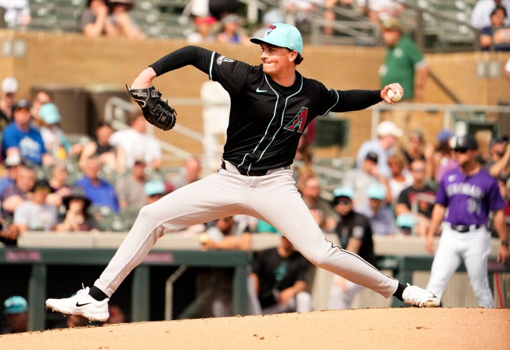 Diamondbacks starting pitcher Tommy Henry throws to the Colorado Rockies in the second inning during a spring training game at Salt River Fields.