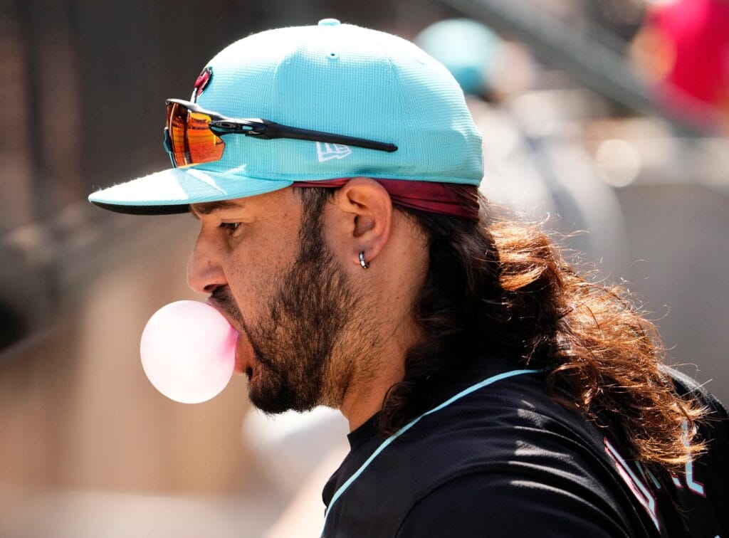 Diamondbacks Eugenio Suarez blows a bubble during a spring training game against the Kansas City Royals at Salt River Fields in Scottsdale on March 14, 2024.
