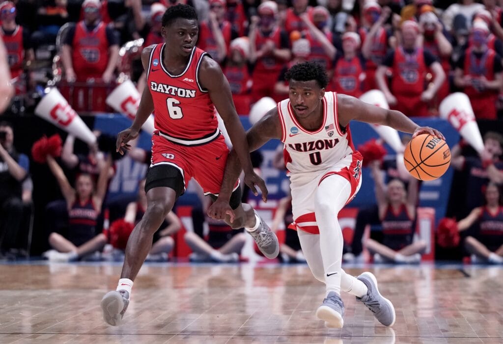 Arizona Wildcats guard Jaden Bradley (0) dribbles against Dayton guard Enoch Cheeks during the second round of the 2024 NCAA Tournament. (Gabriel Mayberry-USA TODAY Sports)