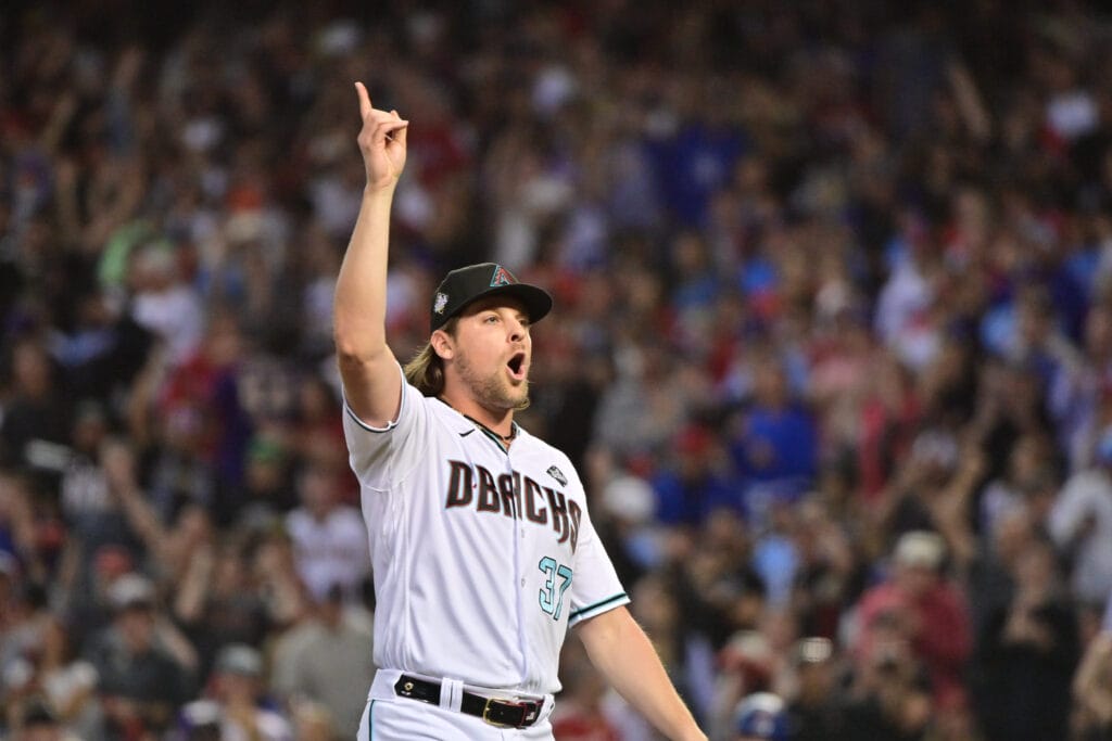 Diamondbacks relief pitcher Kevin Ginkel, a potential replacement for the injured Paul Sewald, walks back to the dugout in the seventh inning against the Texas Rangers in game five of the 2023 World Series at Chase Field.