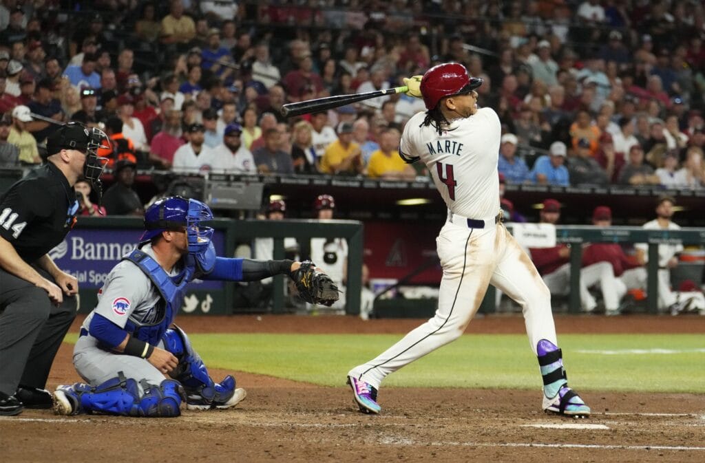 Diamondbacks Ketel Marte (4) hits an RBI single against the Chicago Cubs in the fifth inning at Chase Field in Phoenix on April 17, 2024.