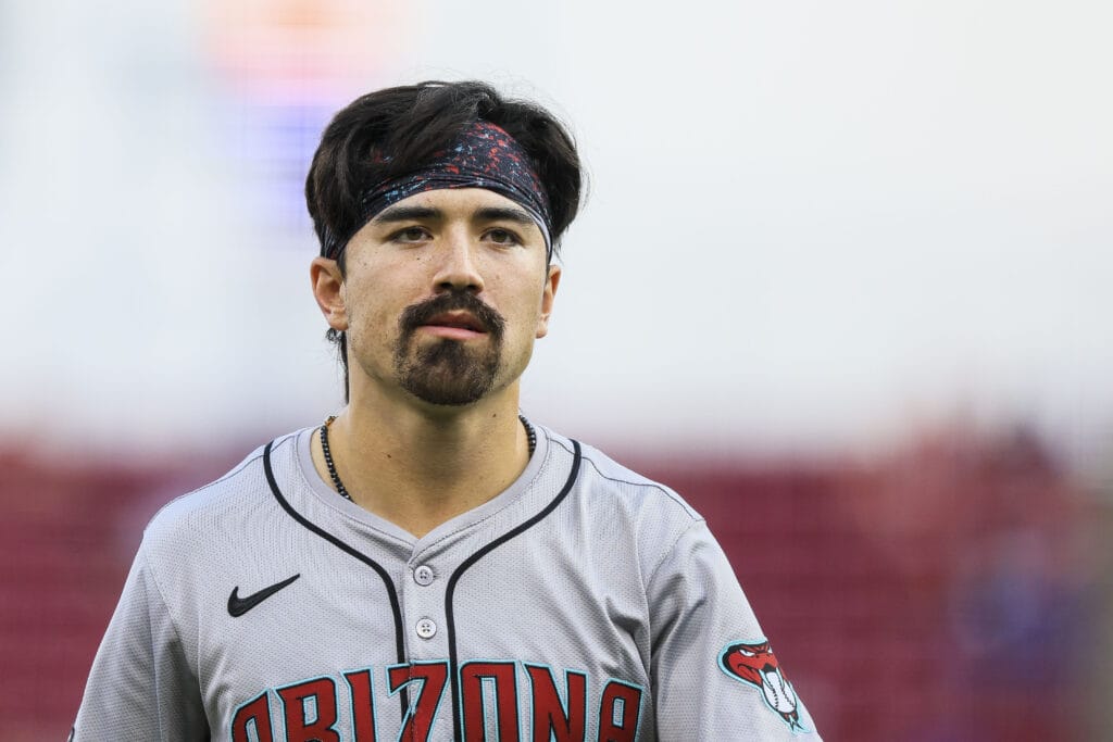 Diamondbacks outfielder Corbin Carroll (7) walks off the field in the third inning against the Cincinnati Reds at Great American Ball Park.