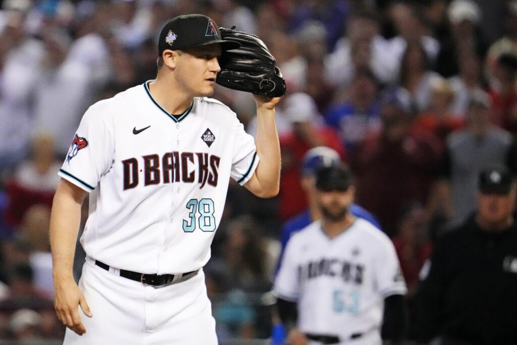 Diamondbacks closer Paul Sewald listens to his PitchCom device during Game 5 of the 2023 World Series.