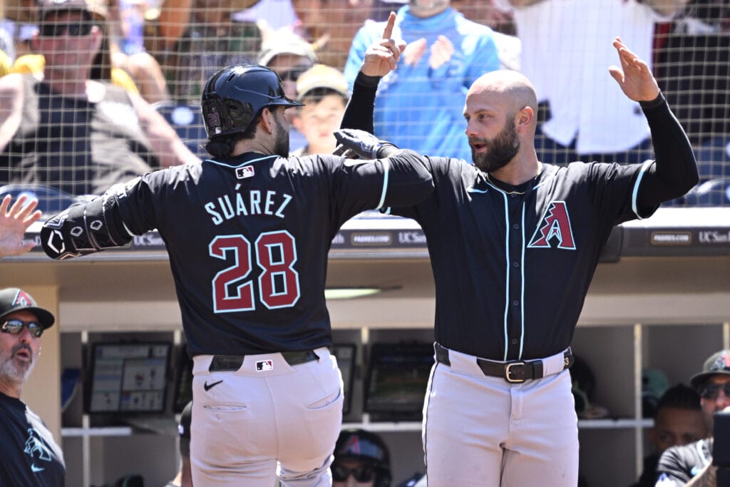 Diamondbacks third baseman Eugenio Suarez (28) celebrates with first baseman Christian Walker (53) after hitting a two-run home run against the San Diego Padres during the seventh inning at Petco Park.
