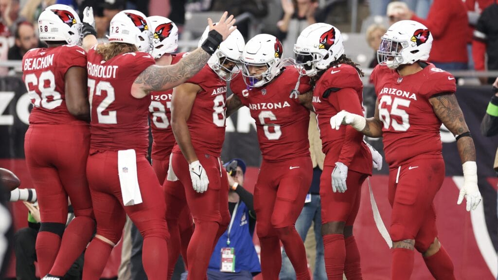 Cardinals running back James Conner celebrates with teammates after a rushing touchdown during the third quarter against the Seattle Seahawks at State Farm Stadium on Jan. 7, 2024 in Glendale, Arizona. (Photo by Christian Petersen/Getty Images)