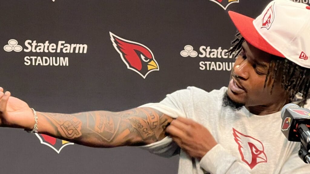 Cardinals cornerback Max melton shows off his new tattoos.