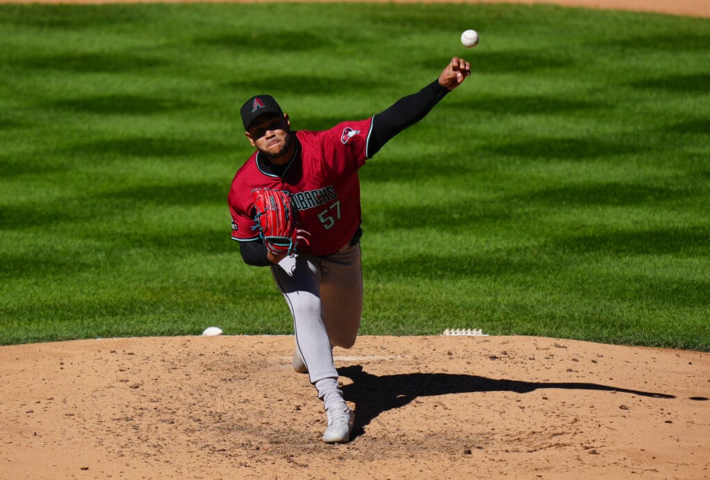 Diamondbacks pitcher Eduardo Rodriguez (57) delivers a pitch in the seventh inning against the Colorado Rockies at Coors Field.