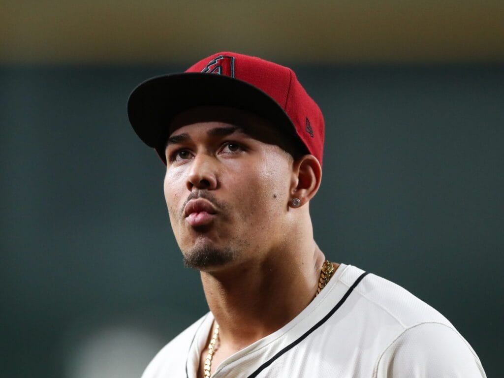 Diamondbacks pitcher Justin Martinez (63) walks off the field after giving the Milwaukee Brewers a two-run lead in the 10th inning on Sept. 15, 2024 at Chase Field in Phoenix.