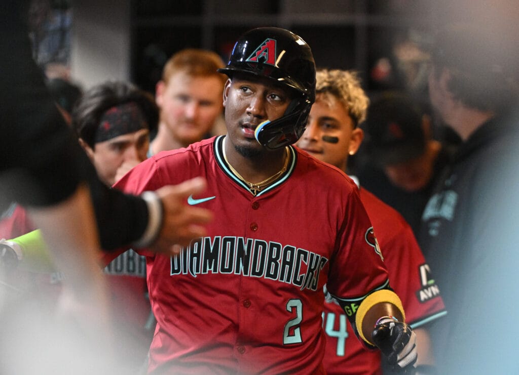Diamondbacks shortstop Geraldo Perdomo (2) celebrates in the dugout after hitting a home run against the Milwaukee Brewers in the fifth inning at American Family Field.