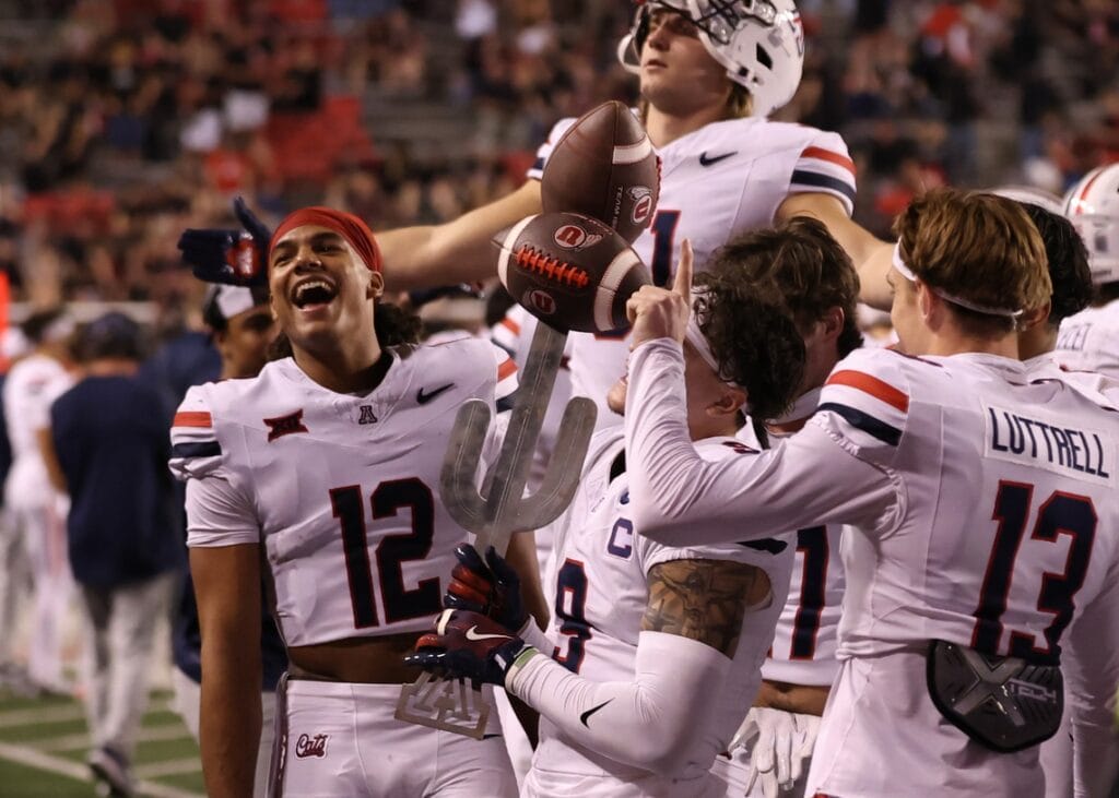 The Arizona Wildcats celebrate a win over the Utah Utes at Rice-Eccles Stadium. (Rob Gray-Imagn Images)