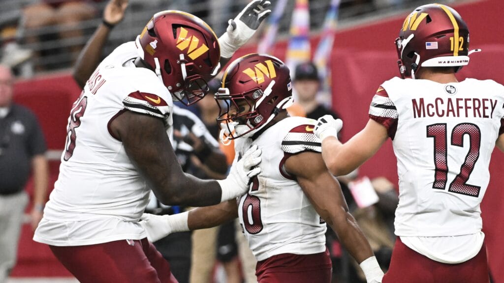 GLENDALE, ARIZONA - SEPTEMBER 29: Jeremy McNichols #26 of the Washington Commanders celebrates after running the ball for a touchdown during the fourth quarter against the Arizona Cardinals at State Farm Stadium on September 29, 2024 in Glendale, Arizona. (Photo by Norm Hall/Getty Images)