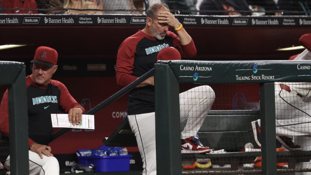 PHOENIX, ARIZONA - SEPTEMBER 27: Manager Torey Lovullo #17 of the Arizona Diamondbacks rubs his head during the fifth inning against the San Diego Padres at Chase Field on September 27, 2024 in Phoenix, Arizona. (Photo by Chris Coduto/Getty Images)