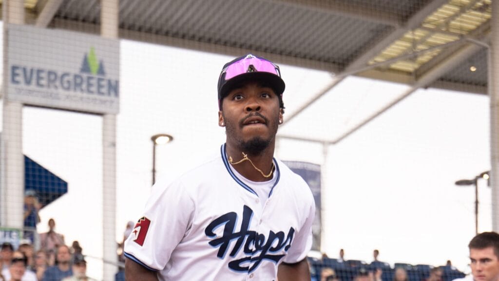 Diamondbacks top prospect Gino Groover walks at the dugout at Ron Tonkin Field in Hillsboro, Oregon.