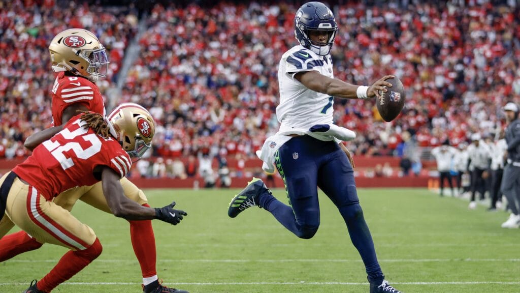 SANTA CLARA, CALIFORNIA - NOVEMBER 17: Geno Smith #7 of the Seattle Seahawks runs for a touchdown in the fourth quarter of a game against the San Francisco 49ers at Levi's Stadium on November 17, 2024 in Santa Clara, California. (Photo by Lachlan Cunningham/Getty Images)