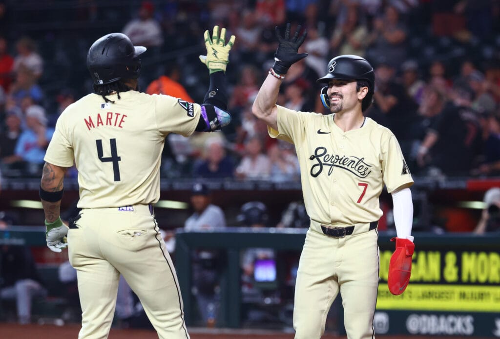 Diamondbacks infielder Ketel Marte (4) celebrates with teammate Corbin Carroll (7) after hitting a two run home run in the first inning against the Minnesota Twins at Chase Field.