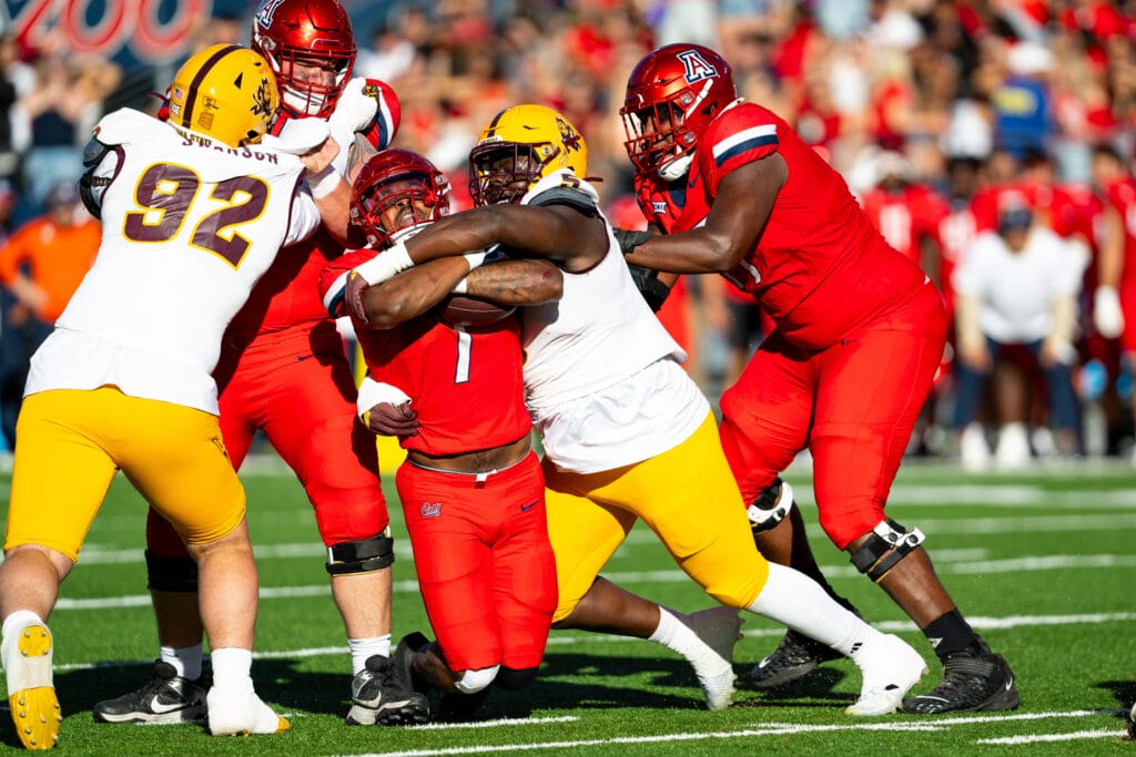 Arizona Wildcats running back Quali Conley gets stopped by Arizona State. (Photo by Danielle Cortez, PHNX Sports)