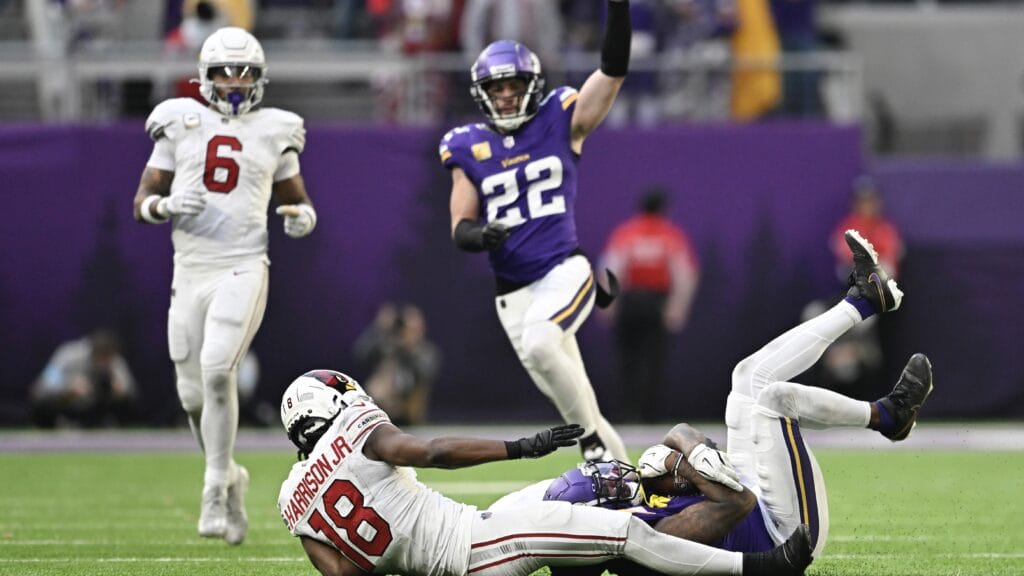 Shaquill Griffin of the Minnesota Vikings intercepts a pass intended for Marvin Harrison Jr. #18 of the Arizona Cardinals during the fourth quarter at U.S. Bank Stadium on December 01, 2024 in Minneapolis, Minnesota. (Photo by Stephen Maturen/Getty Images)