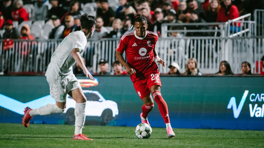 Darius Johnson, who was substituted on by Pa-Modou Kah in the second half against FC Tulsa, runs forward with the ball at his feet