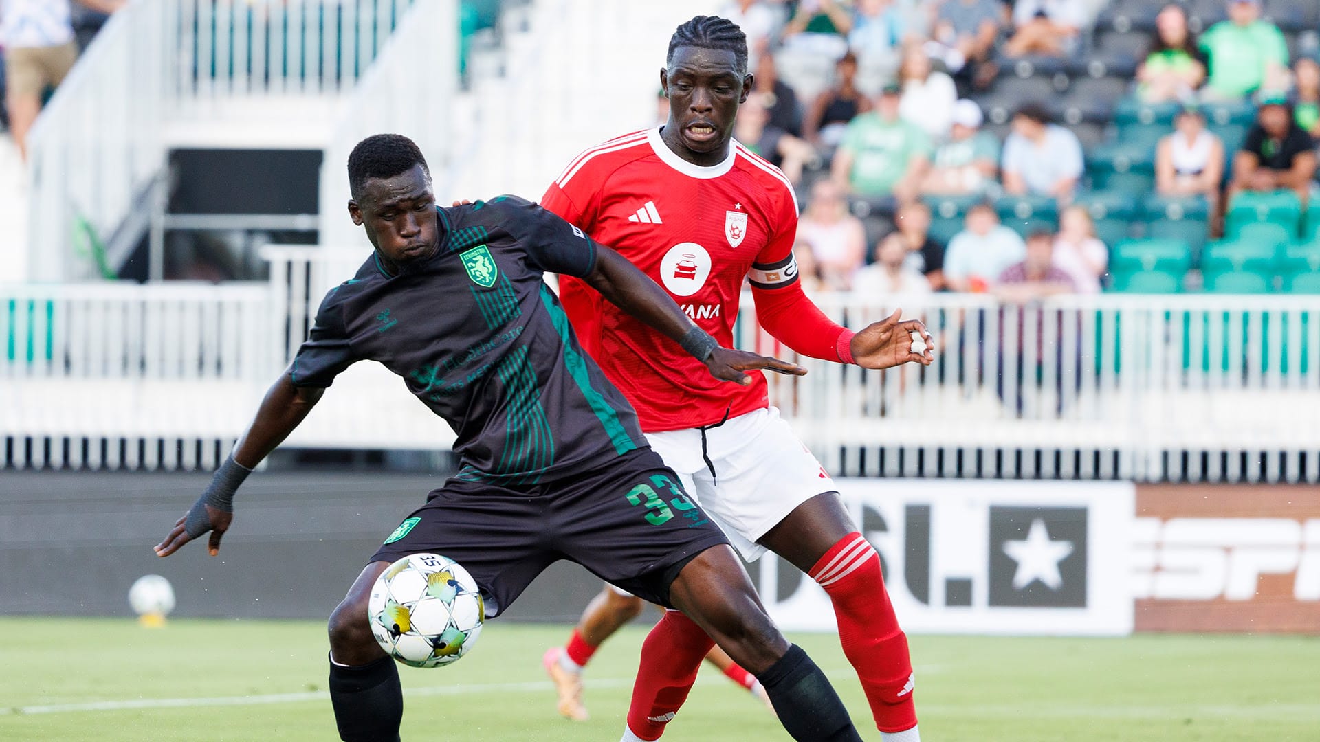Players jostle for the ball in a 2-0 Phoenix Rising loss against Lexington SC