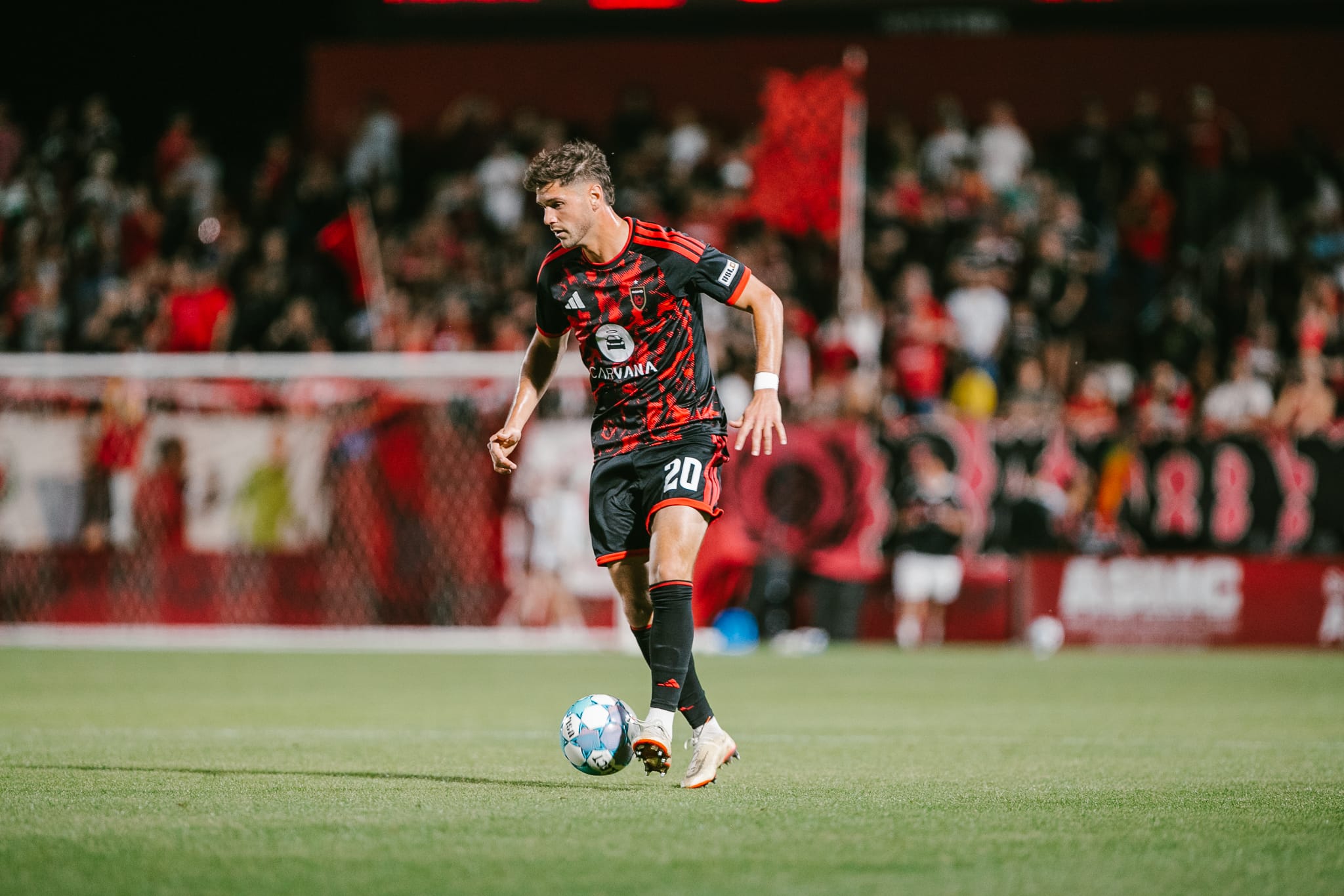 Luke Biasi dribbles the ball in Phoenix Rising's home opener. Image: Phoenix Rising / Ashley Orellana