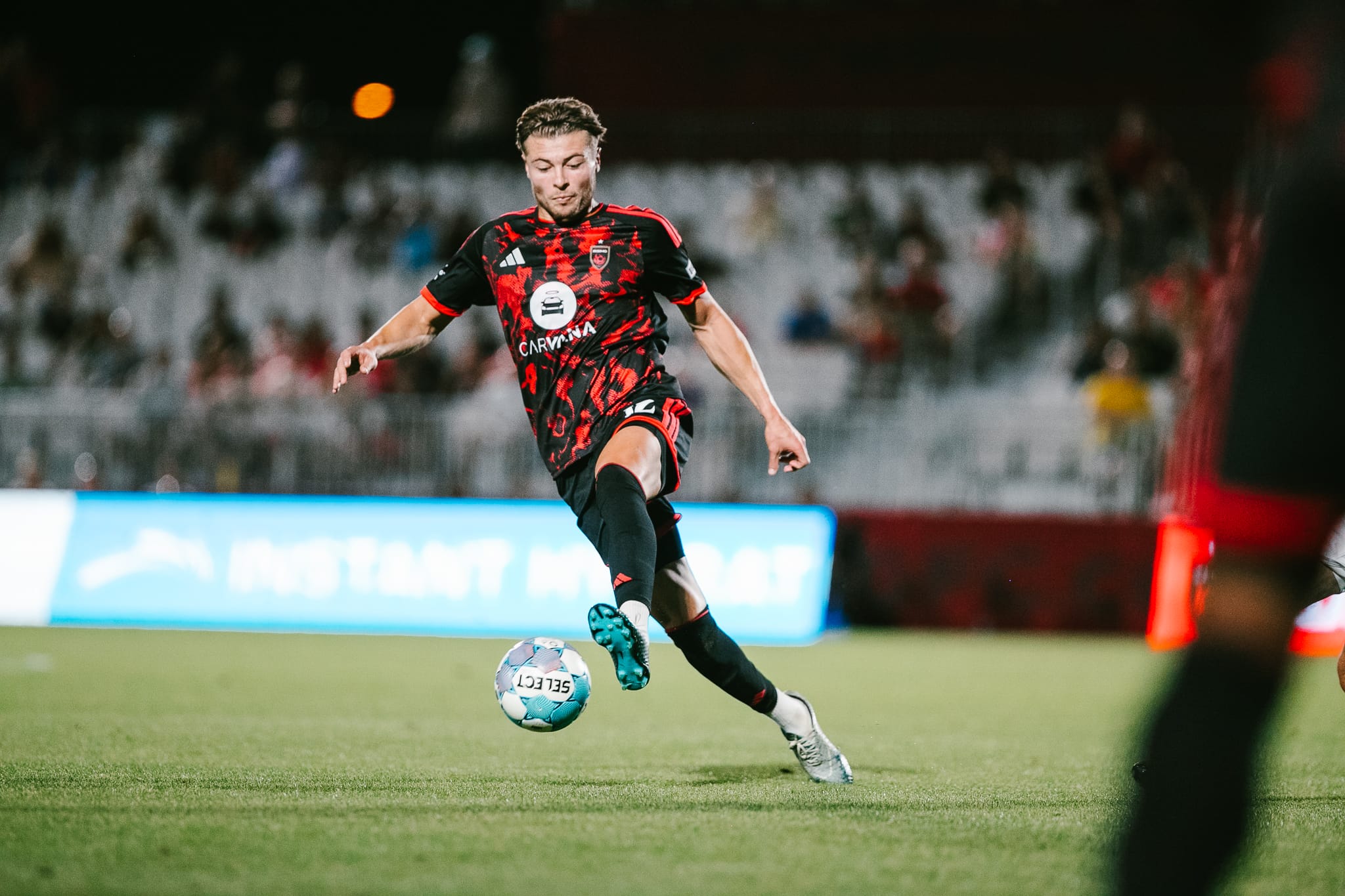 Charlie Dennis plays the ball for Phoenix Rising against Oakland Roots.