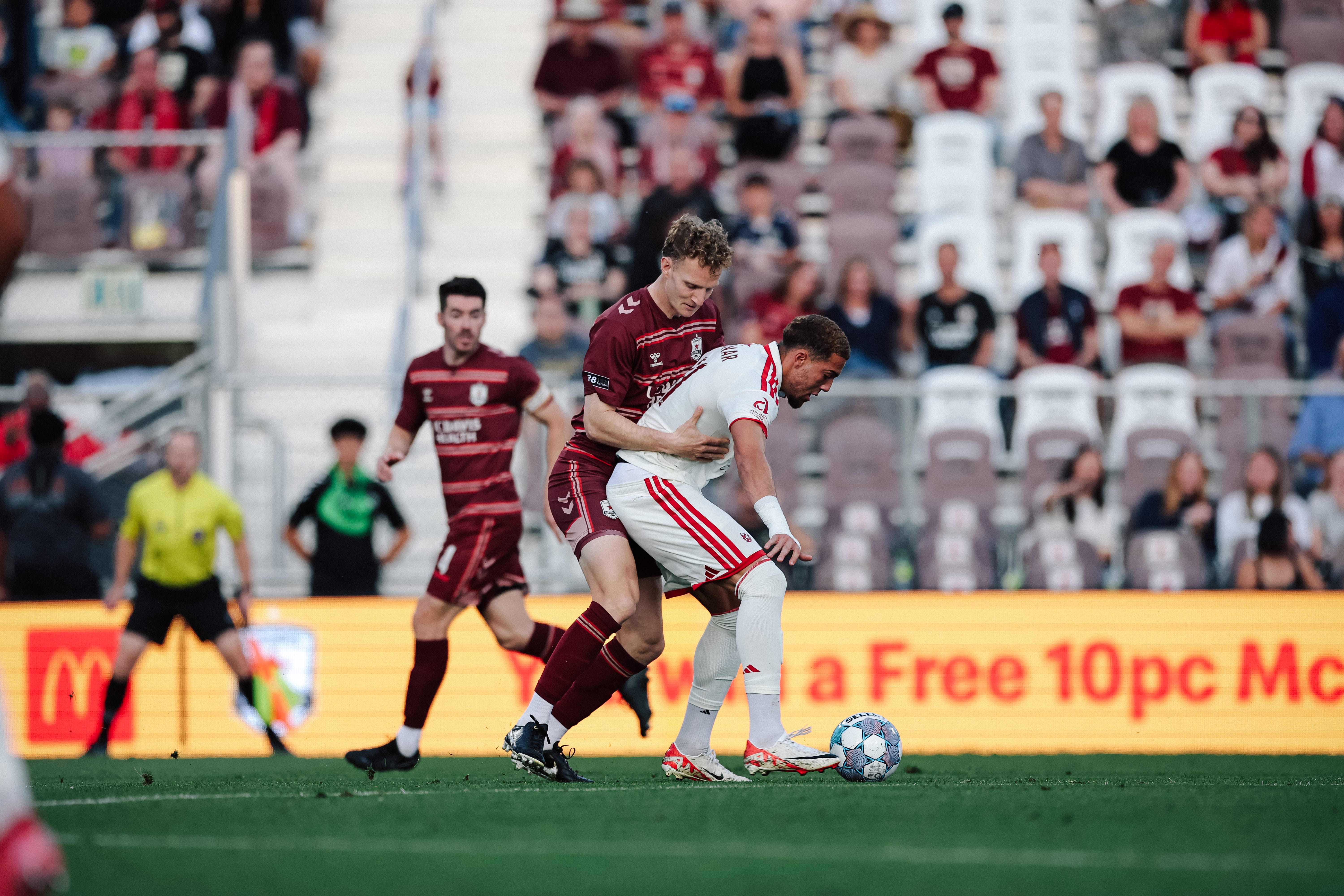 Phoenix Rising player shields the ball from a Sacramento Republic player.