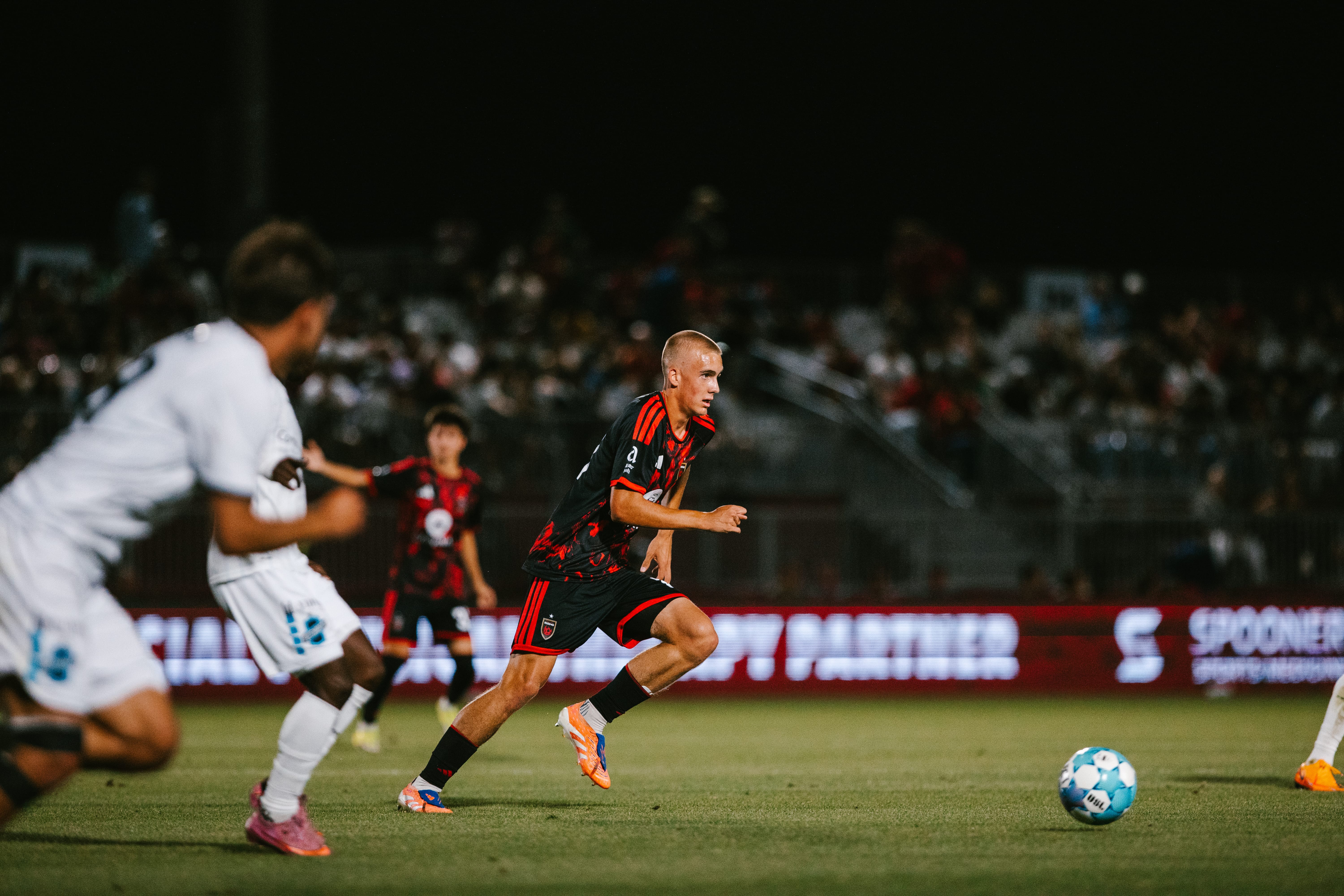 Jaethan Irwin chases the ball in a USL Cup match.