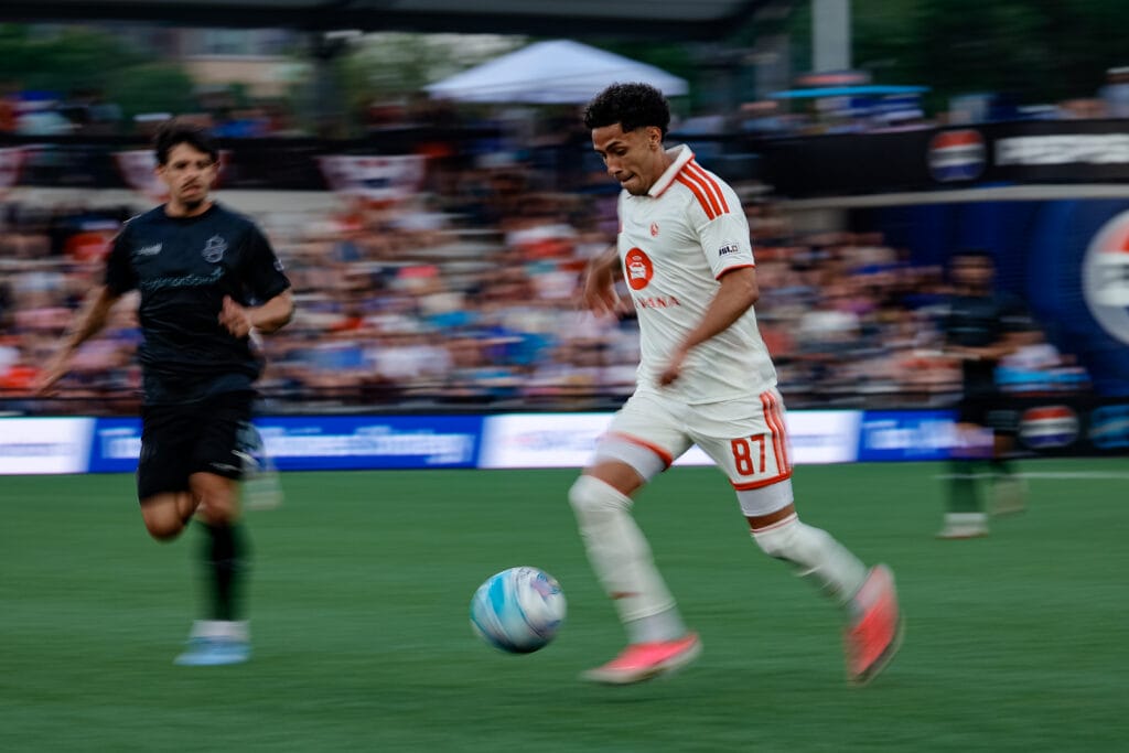 Daniel Flores of Phoenix Rising runs with the ball at his feet against Colorado Springs Switchbacks