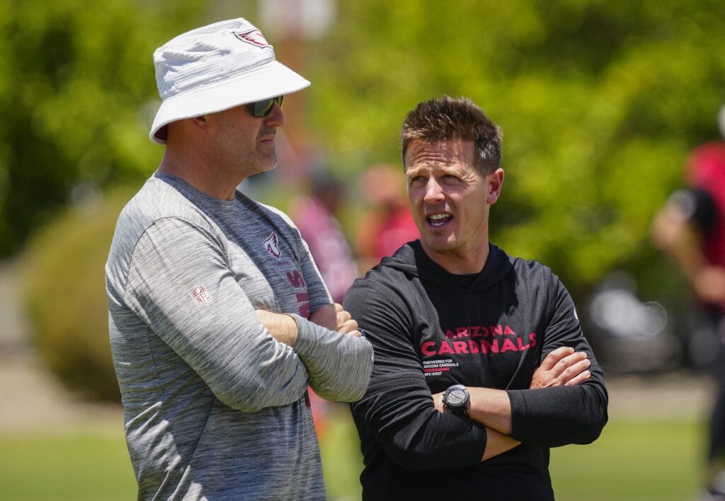 Cardinals general manager Monti Ossenfort (left) talks with head coach Mike LaFleur during organized team activities at the Cardinals Training Facility in Tempe on May 27, 2026.