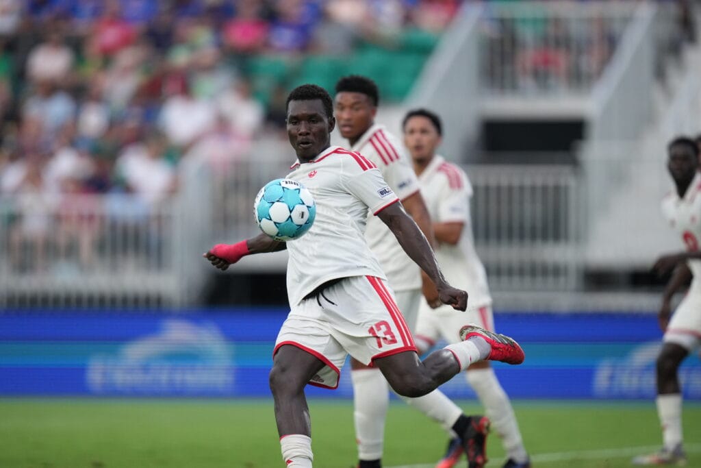 Jean-Eric Morsou of Phoenix Rising lines up to kick the ball against Lexington SC