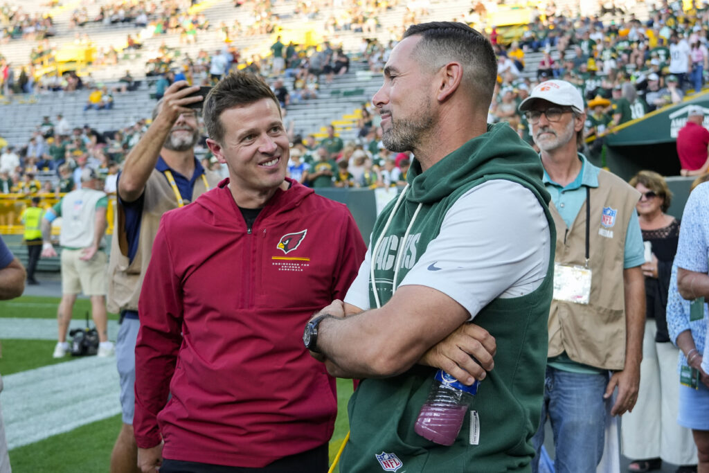 Aug 28, 2026; Green Bay, Wisconsin, USA; Arizona Cardinals head coach Mike LaFleur talks with Green Bay Packers head coach Matt LaFleur prior to the game at Lambeau Field. Mandatory Credit: Jeff Hanisch-Imagn Images