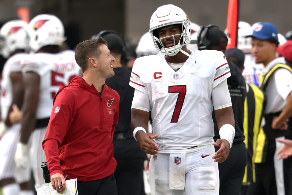 Sep 13, 2026; Inglewood, California, USA; Arizona Cardinals head coach Mike LaFleur talks with quarterback Jacoby Brissett (7) during the first half of their game against the Los Angeles Chargers at SoFi Stadium. Mandatory Credit: Kiyoshi Mio-Imagn Images