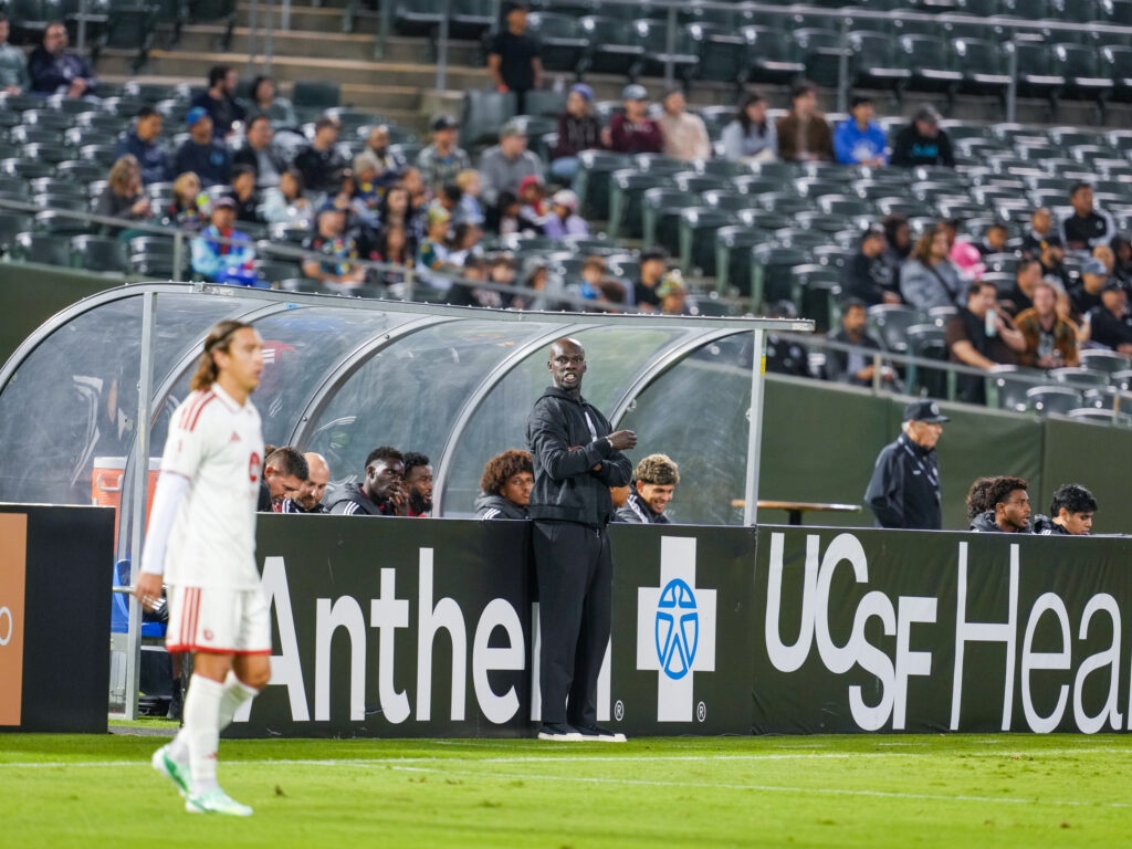 Phoenix Rising head coach Pa-Modou Kah watches his side fall 3-0 in Oakland.