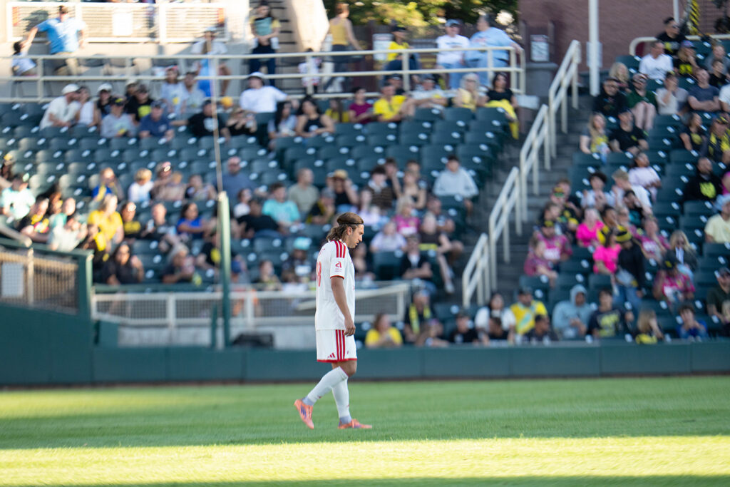 Phoenix Rising defender Tate Schmitt stands on the field at Isotopes Park