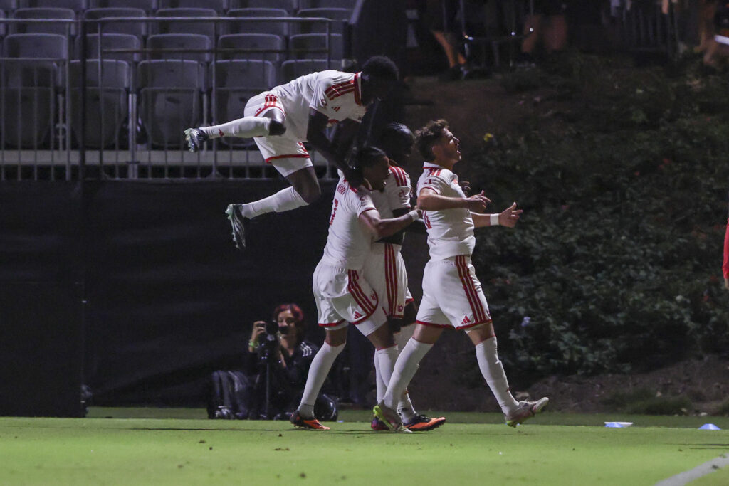 Phoenix Rising players celebrate a goal against Orange County SC.
